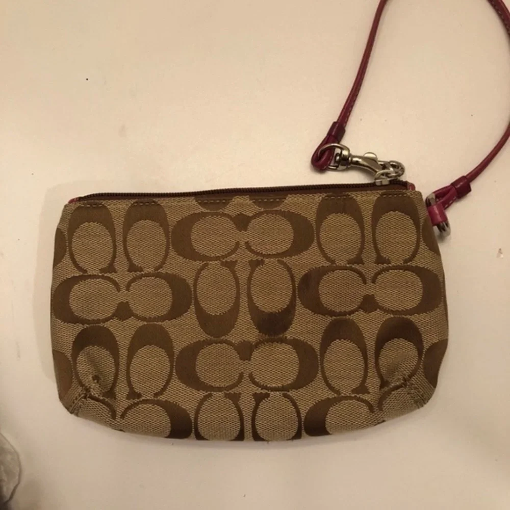 Coach signature brown dark pink leather wristlet